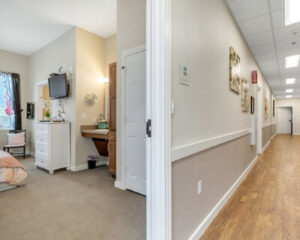 Hallway & Private Room at Sundara Memory Care Community in Round Rock