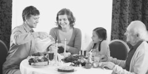 Family of three generations enjoying thanksgiving dinner