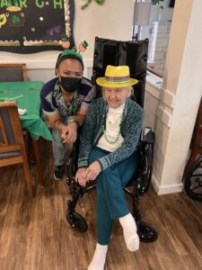 team member and resident celebrating St. Patrick's Day 2022