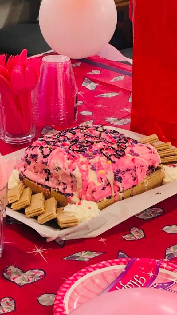 Pink strawberry cream cheese Birthday Cake made by Tye for resident birthday