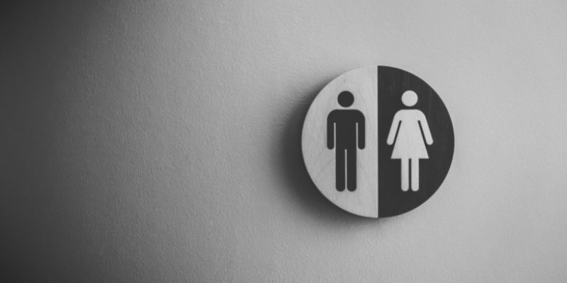male and female signs for public restroom