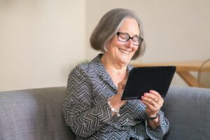 Elderly woman on a tablet